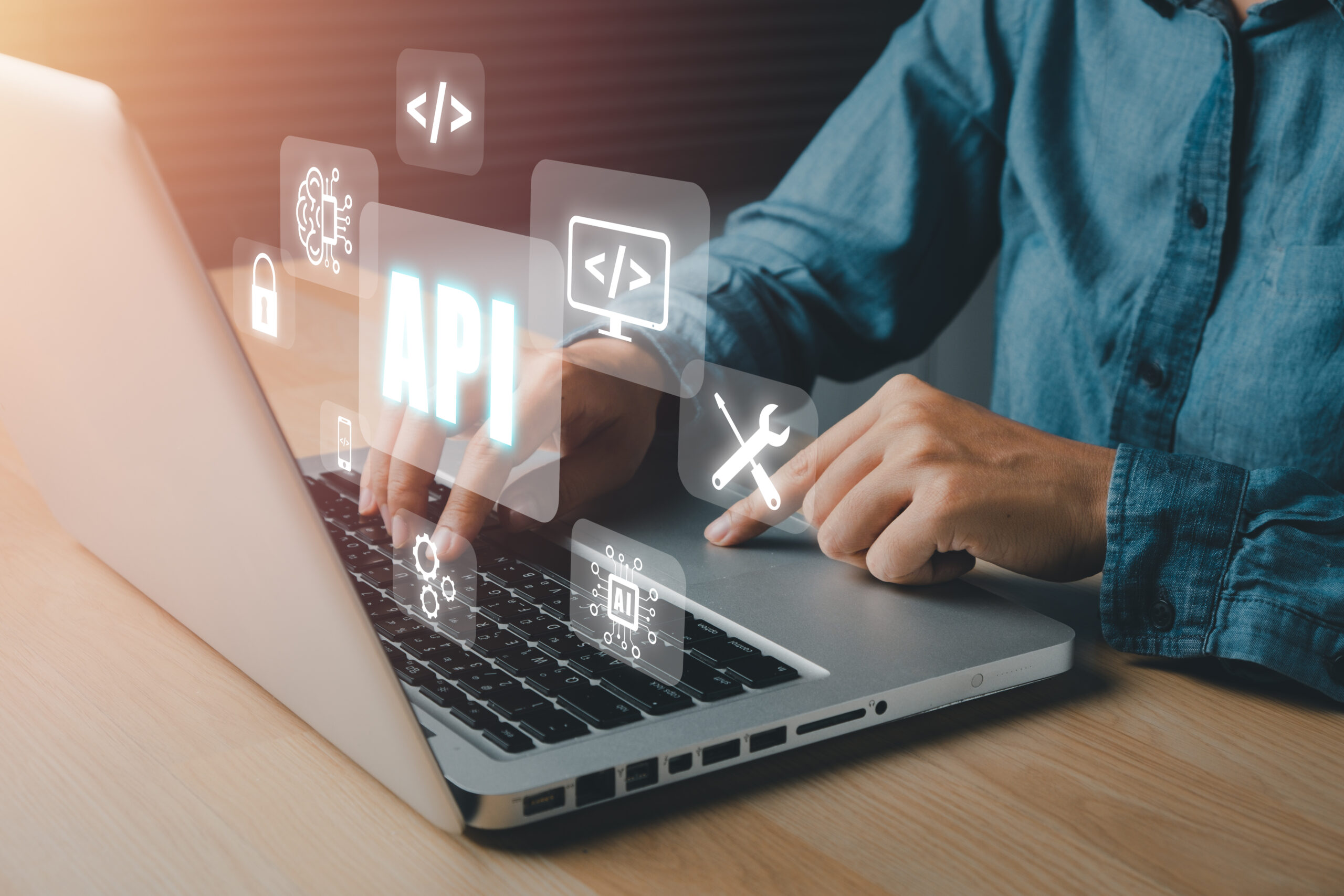 API - Application Programming Interface, Woman using laptop computer with VR screen API icon on office desk, Software development tool, modern technology, internet and networking concept.. API Application Programming